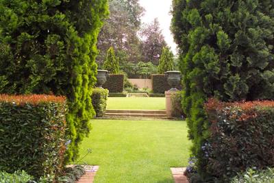 Garden design by Shirley Wallington — Long vista through the hedges to top garden