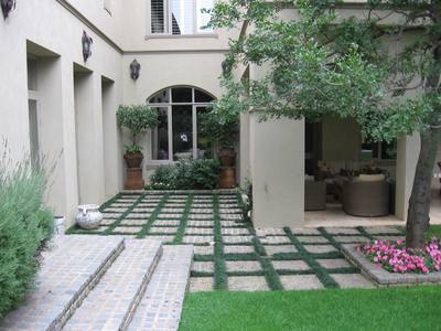 Garden design by Shirley Wallington — Mondo grass planted between blocks is an easy way to soften hard surfaces