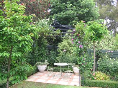 Garden design by Shirley Wallington — Pergola in the corner of the garden