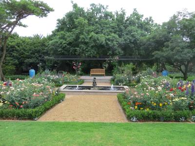 Garden design by Shirley Wallington — Rose garden with pond and pergola