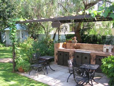 Garden design by Shirley Wallington — Small seating area with braai and pizza facilities